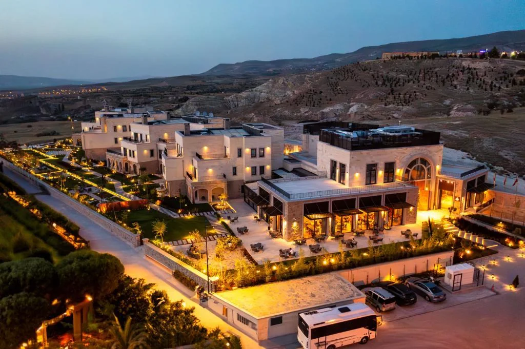 The Alden Hotel illuminated at night in Cappadocia