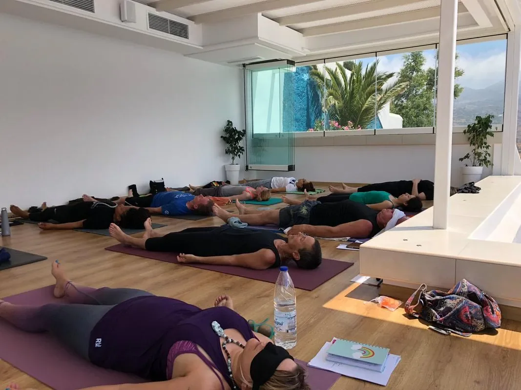 Students resting at the end of Mysore practice on retreat