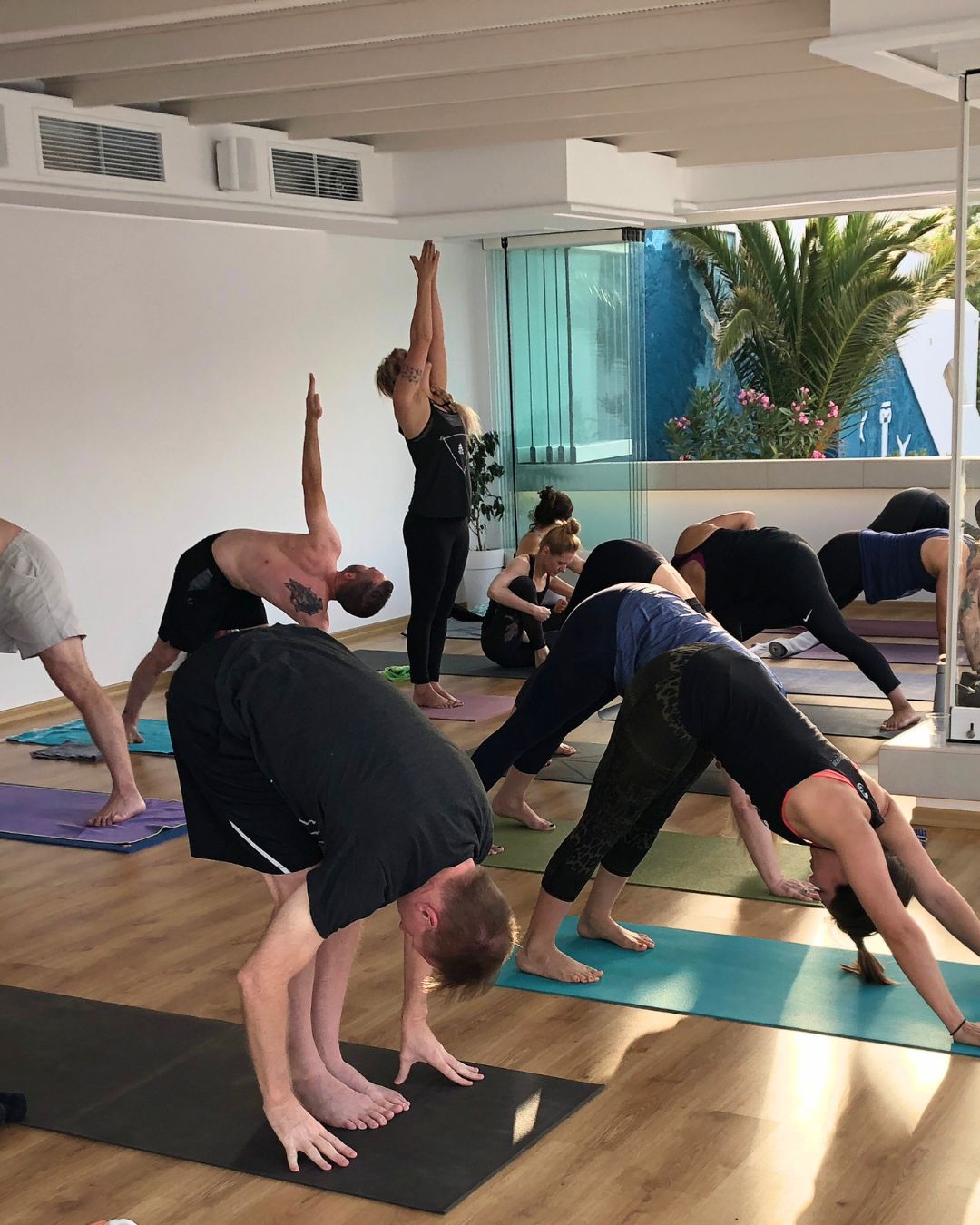 Students practicing yoga together during a previous retreat