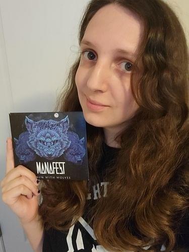 Fan holding the I Run With Wolves CD