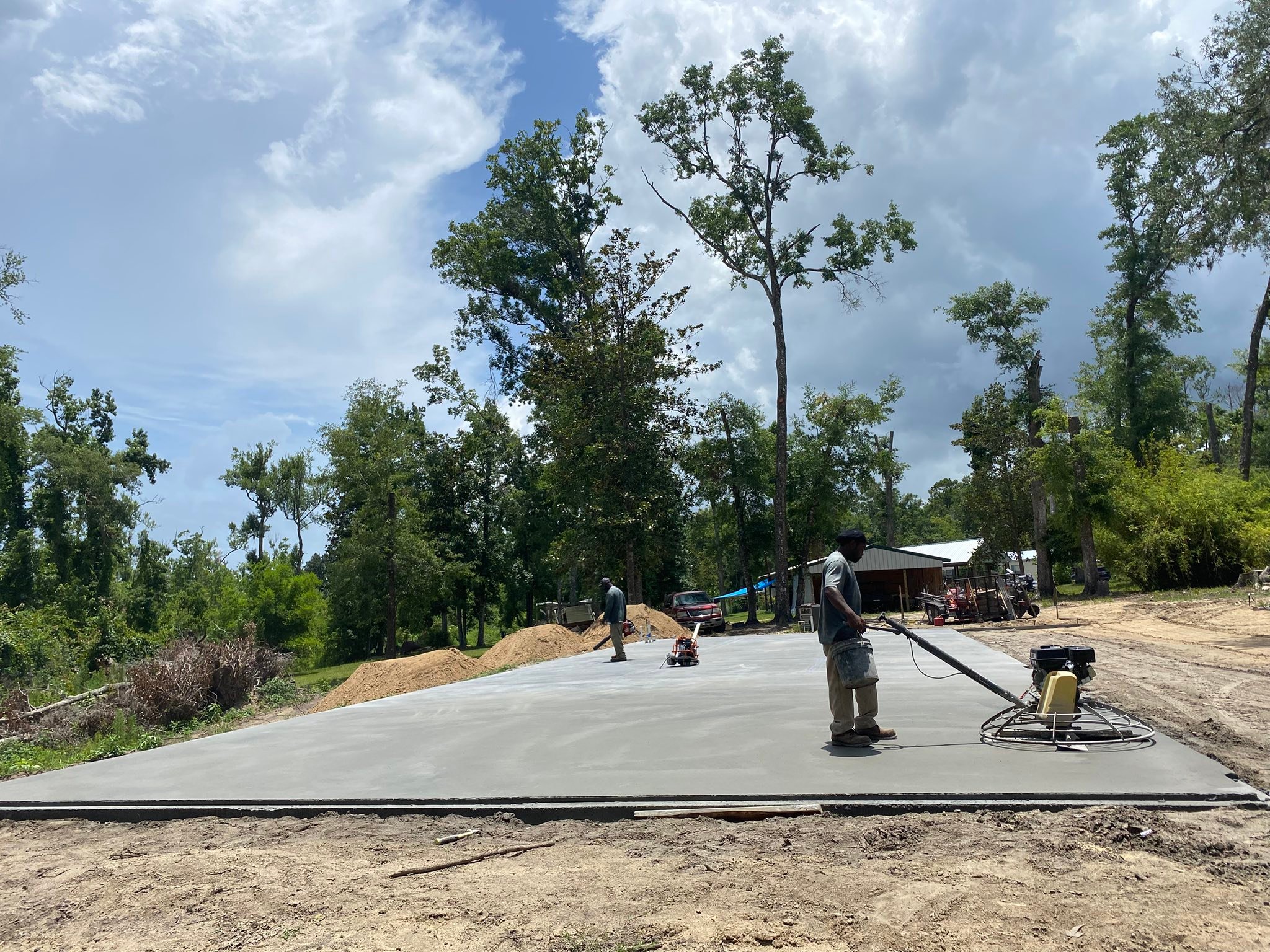 James Reed Concrete crew power-troweling a freshly poured slab at a North Florida jobsite