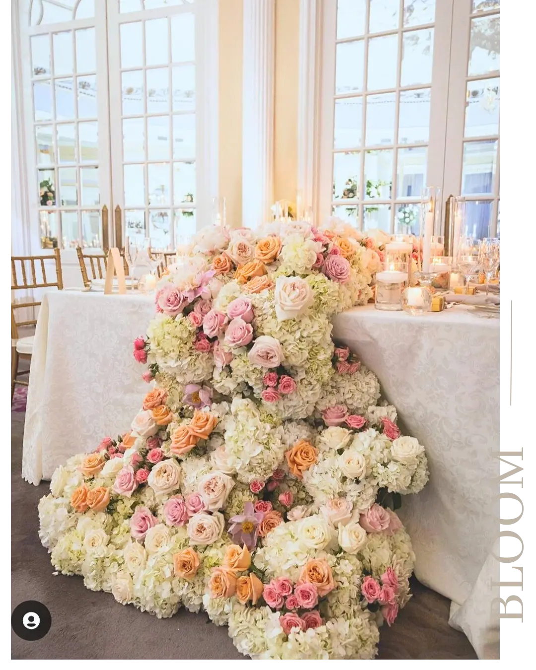Wedding head table floral design with pink roses and baby’s breath created by a Montreal wedding florist