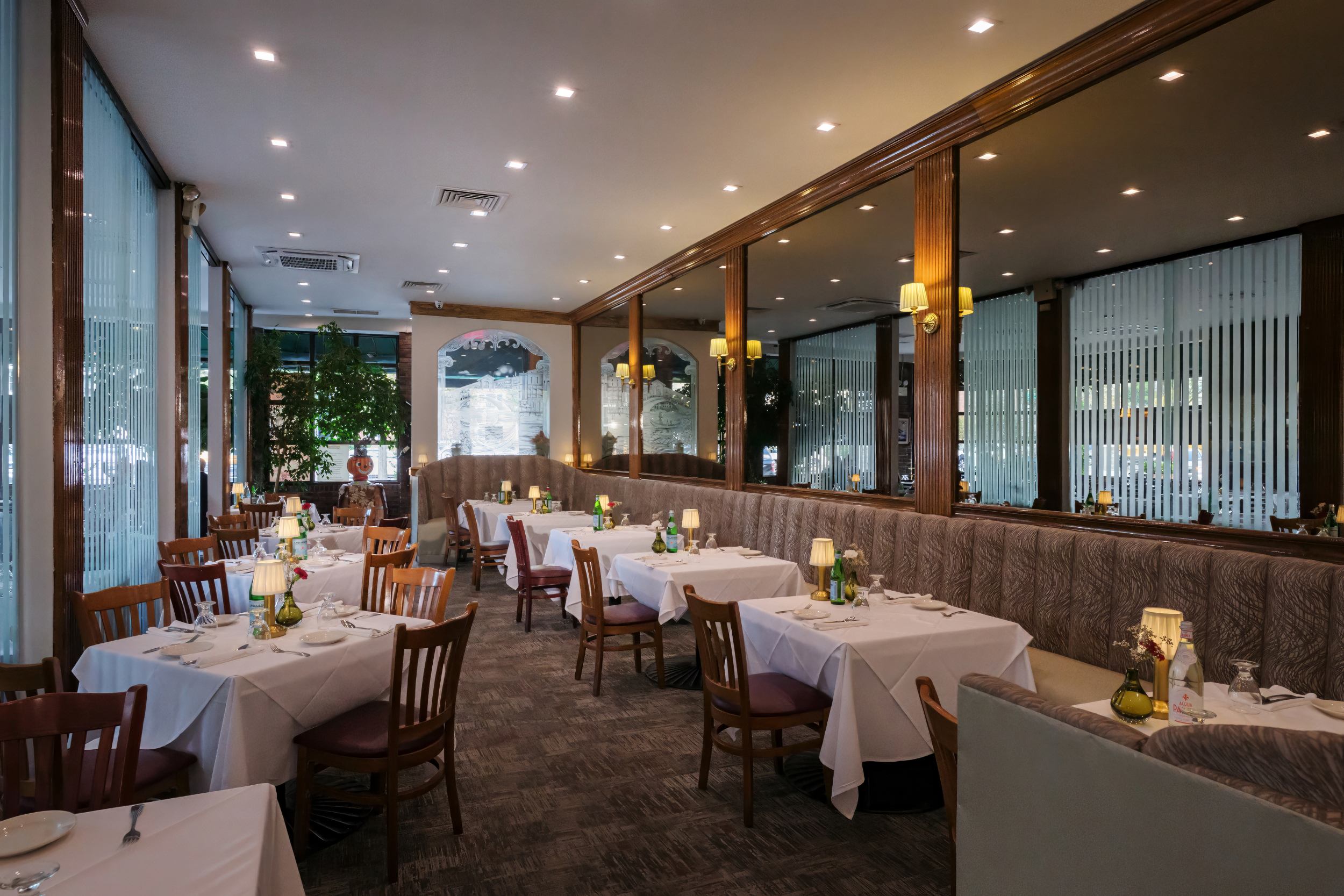 Mirrored dining room with warm lighting at Portofino Ristorante