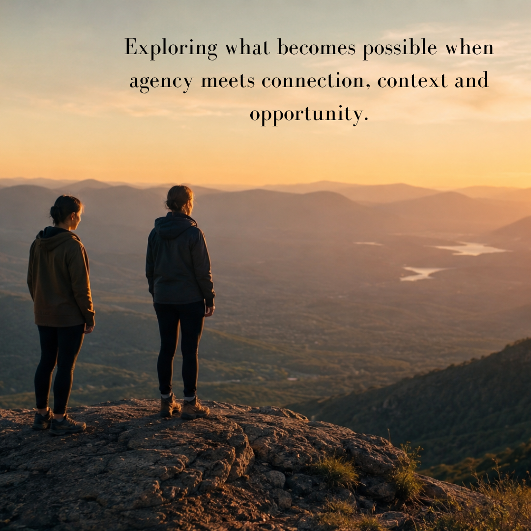 Person standing at the edge of a vast landscape with another person nearby, representing human potential, connection and possibility. Person standing at the edge of a vast landscape with another person nearby, representing human potential, connection and possibility.
