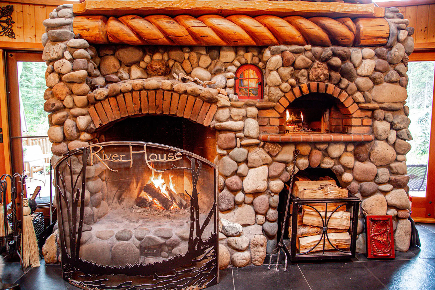 Main floor wood-burning fireplace at River House