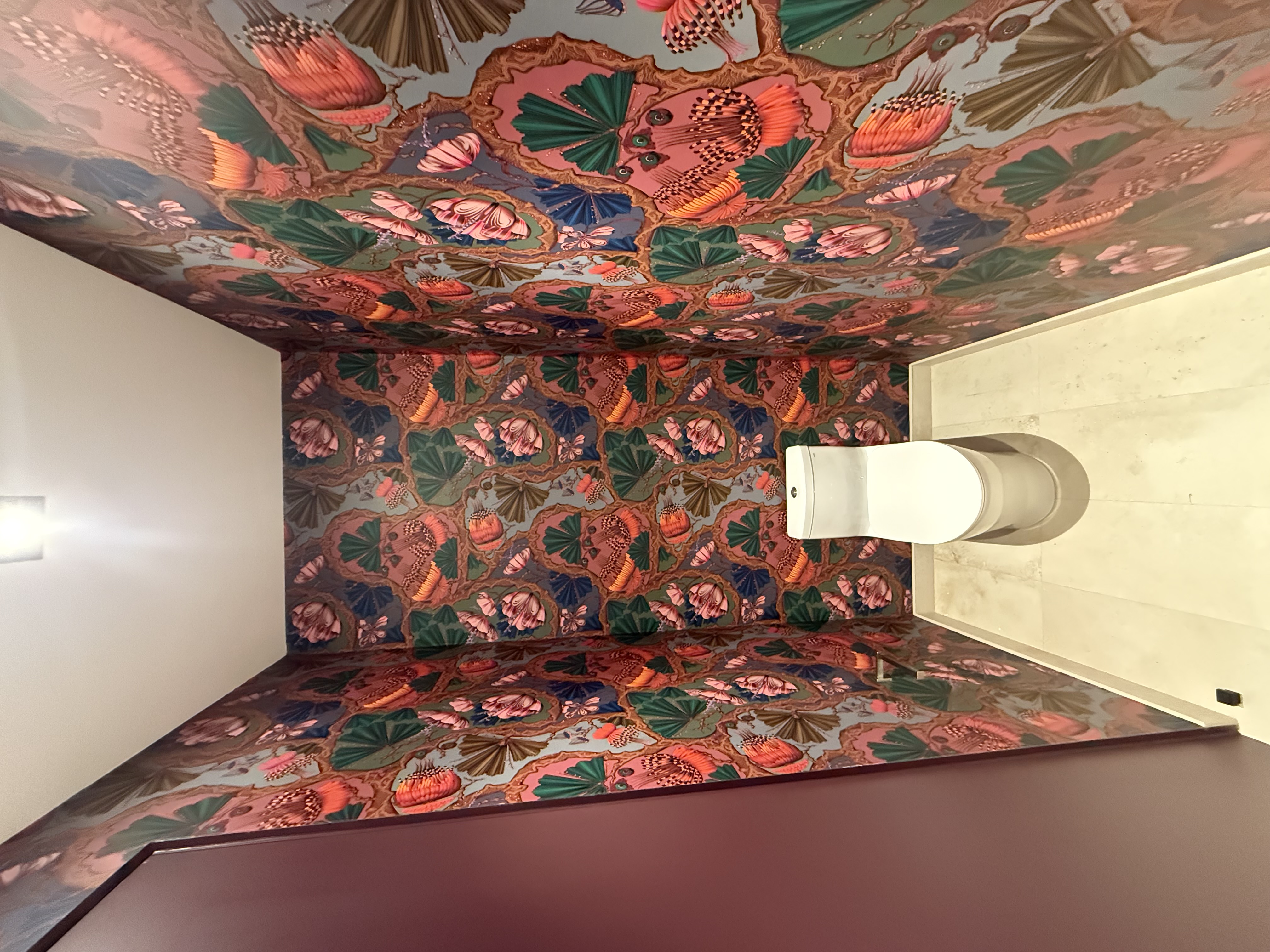 “Living room wall covered with textured grasscloth wallpaper installed by 510 Painting & Decorating – natural fiber finish and seamless application.”