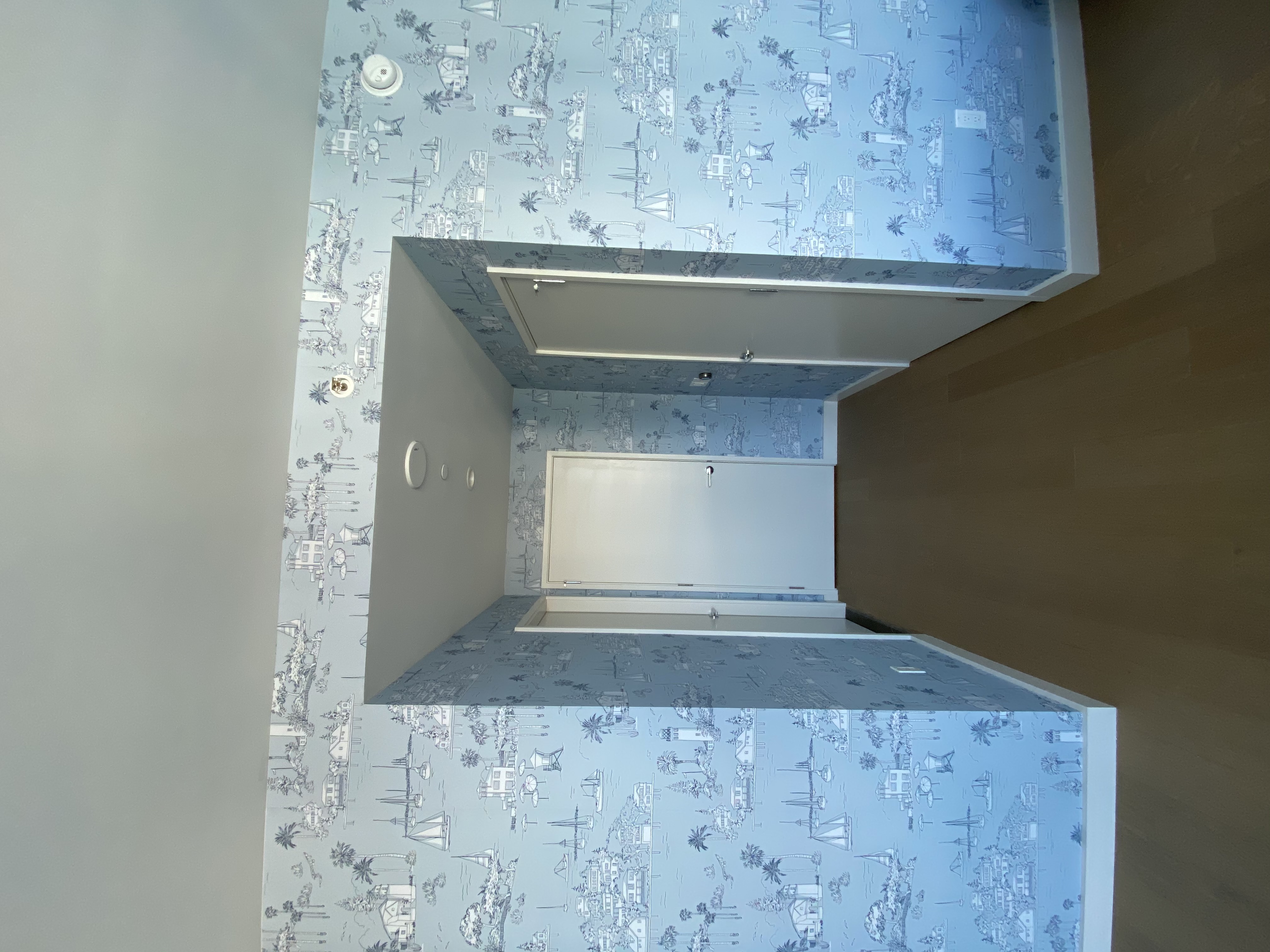 “Peel-and-stick removable wallpaper installation in a modern interior space — clean finish with bold design.”