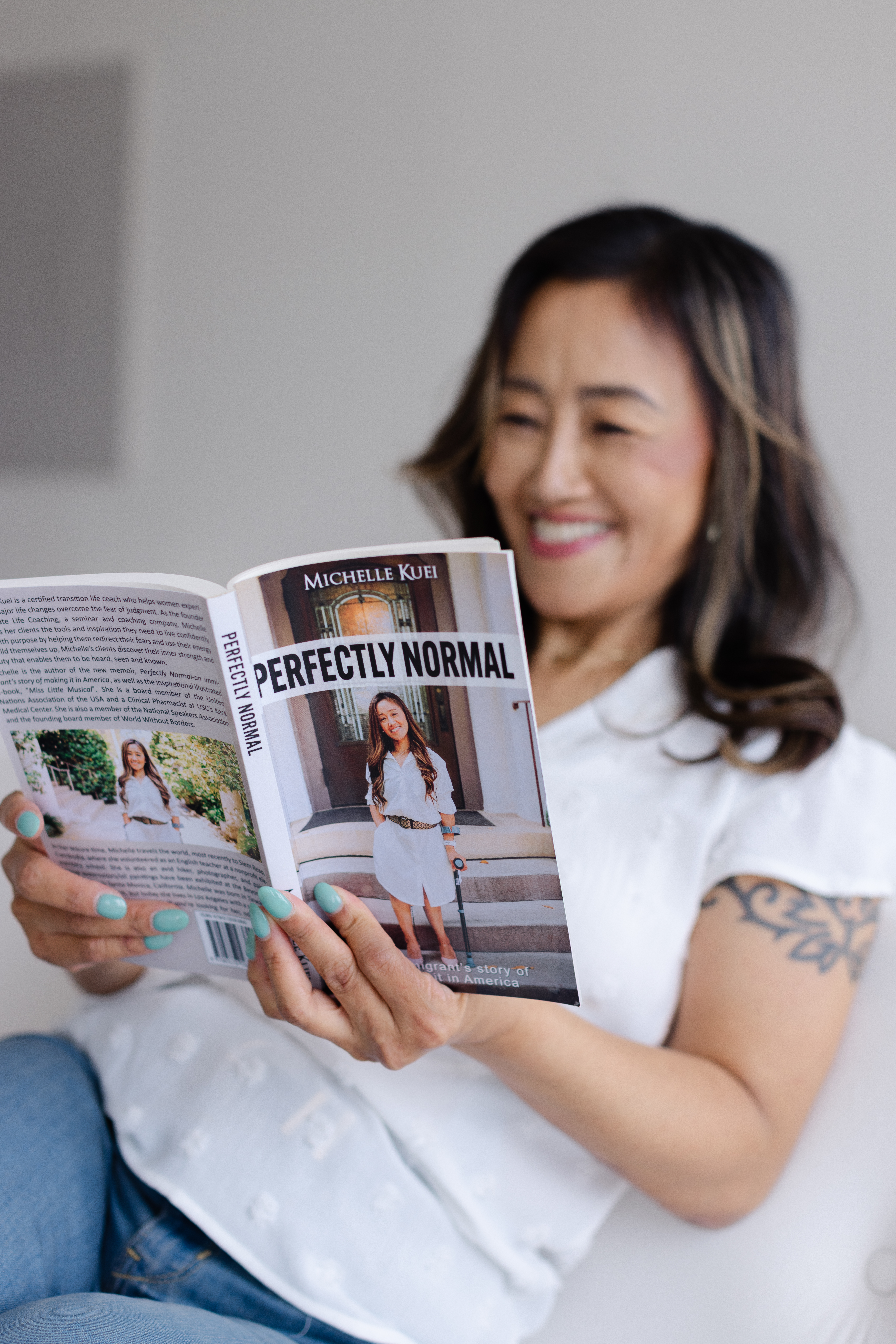 Michelle Kuei with the book she published that nobody bought