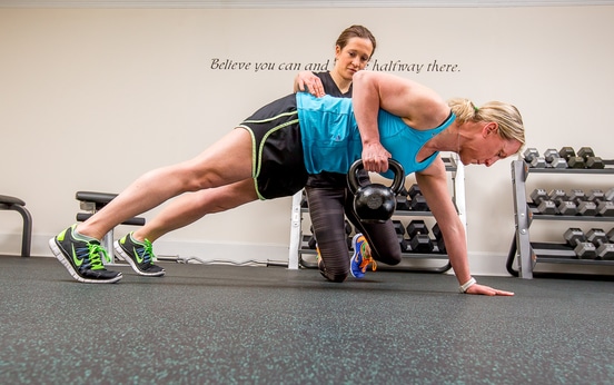 Student learning to coach in a real gym environment during a personal trainer course Student learning to coach in a real gym environment during a personal trainer course