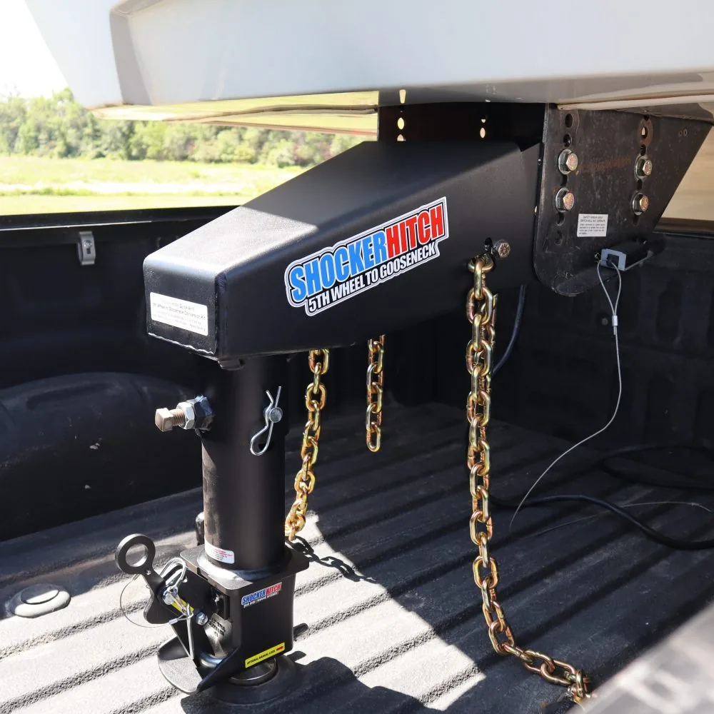 Shocker Quick Air 5th-to-gooseneck Shift Lock conversion kit installed on a 5th wheel camper with safety chains