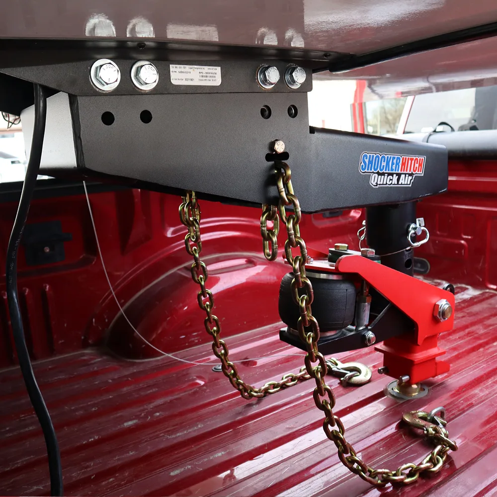 Shocker Quick Air 5th wheel to gooseneck kit on a Lippert Turning Point pin box with safety chains installed