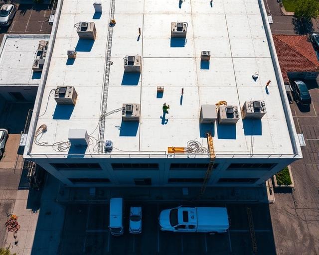 Large roofing crew on commercial building