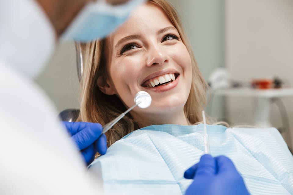 A relaxed patient being examined in the chair at Integrity Dental Boston