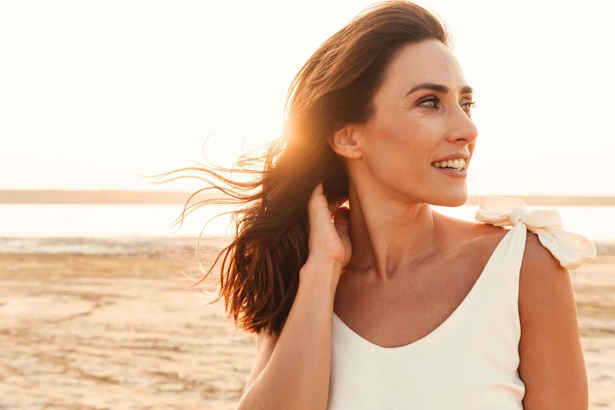 A woman in warm evening sun, relaxed and full of energy