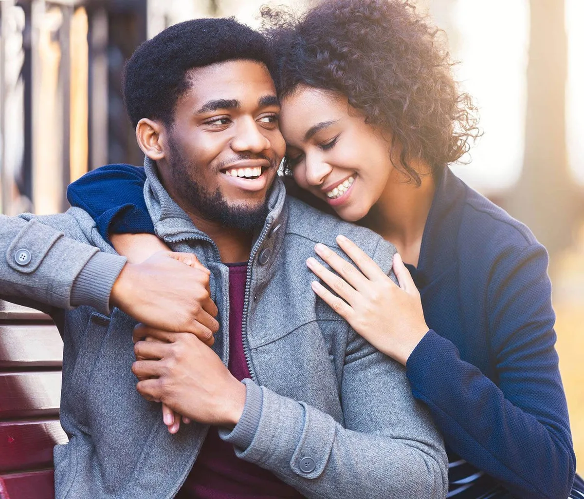 Couple embracing and laughing