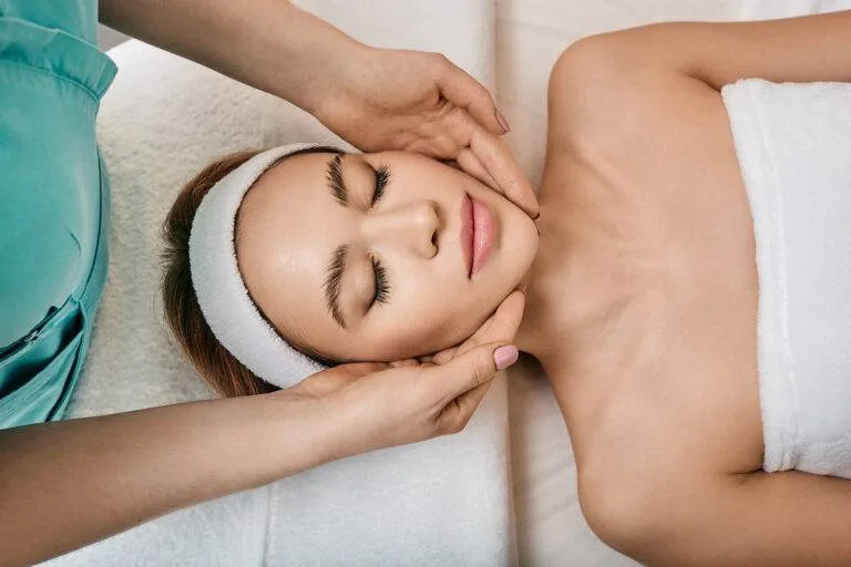 Woman receiving a relaxing facial treatment