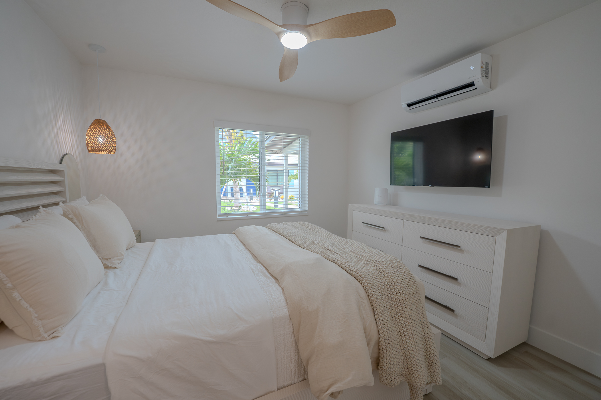 Bright refreshed living room with new flooring and custom details in Pinellas County FL