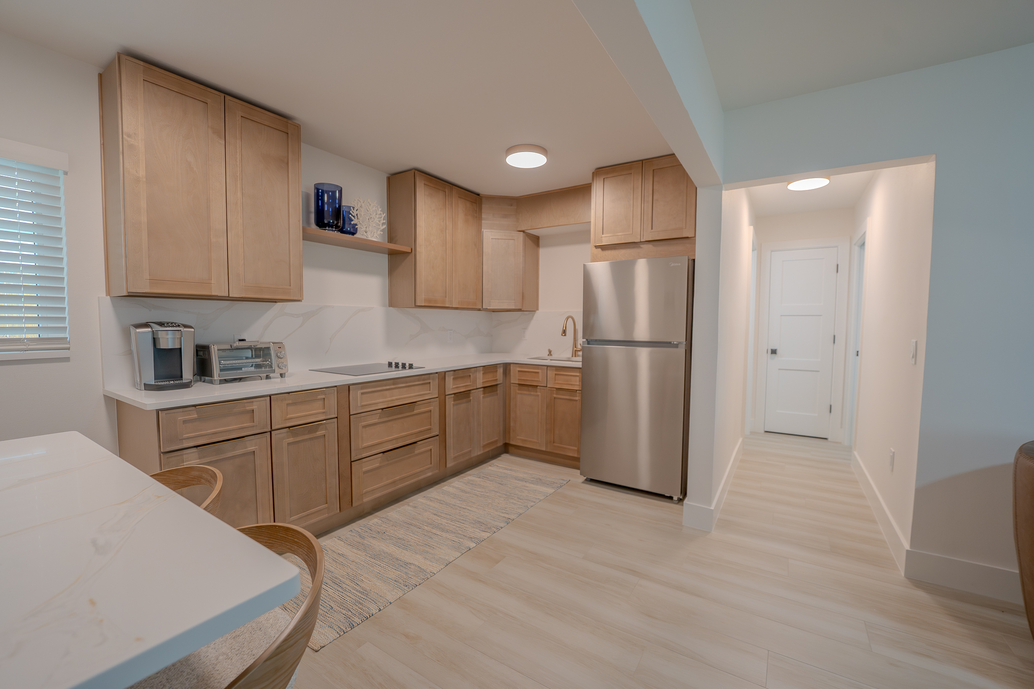 Open custom kitchen design with cabinetry and island along the Florida beaches