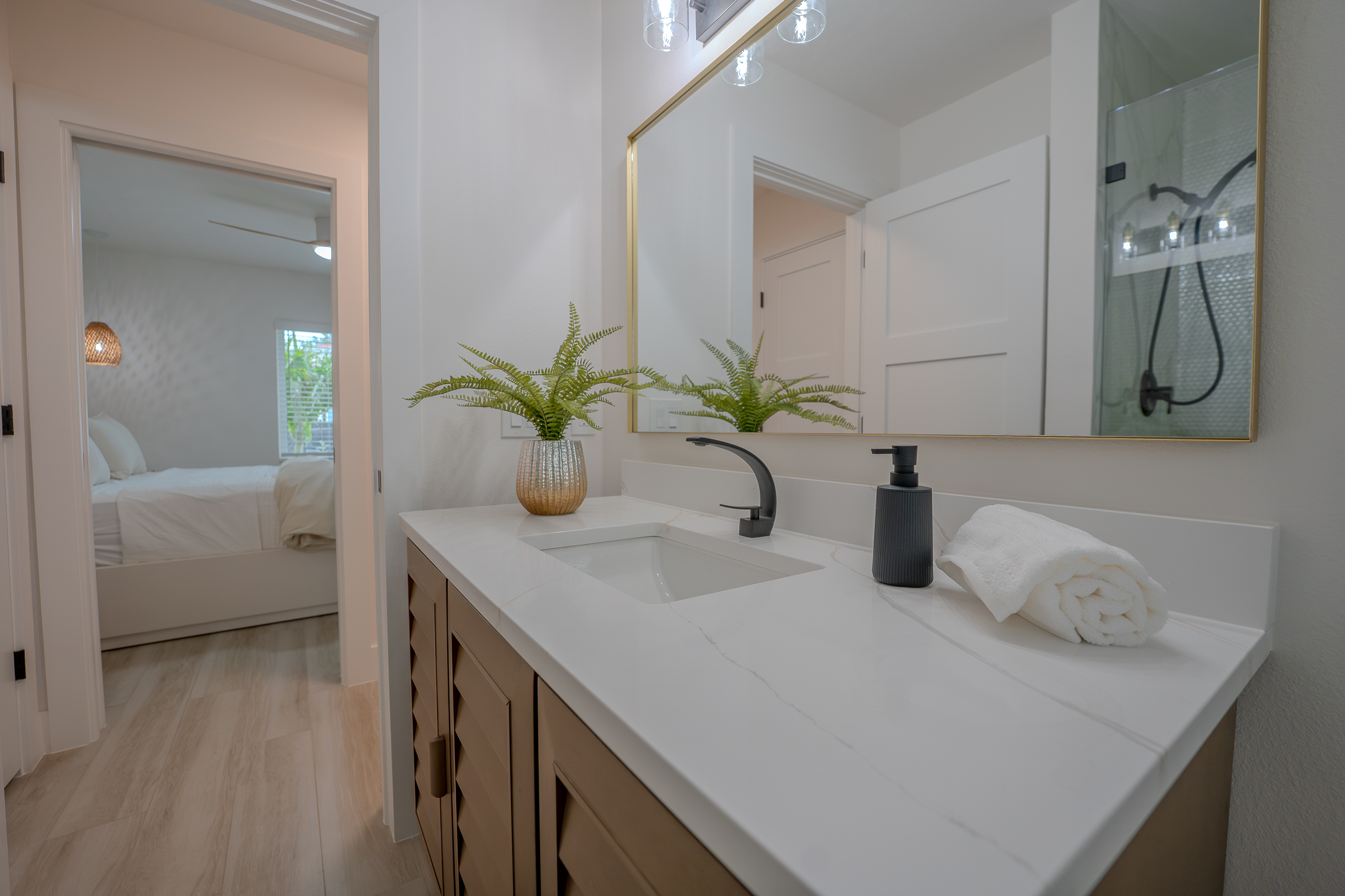 Bathroom renovation combining custom vanity and tiled shower surround in Largo FL