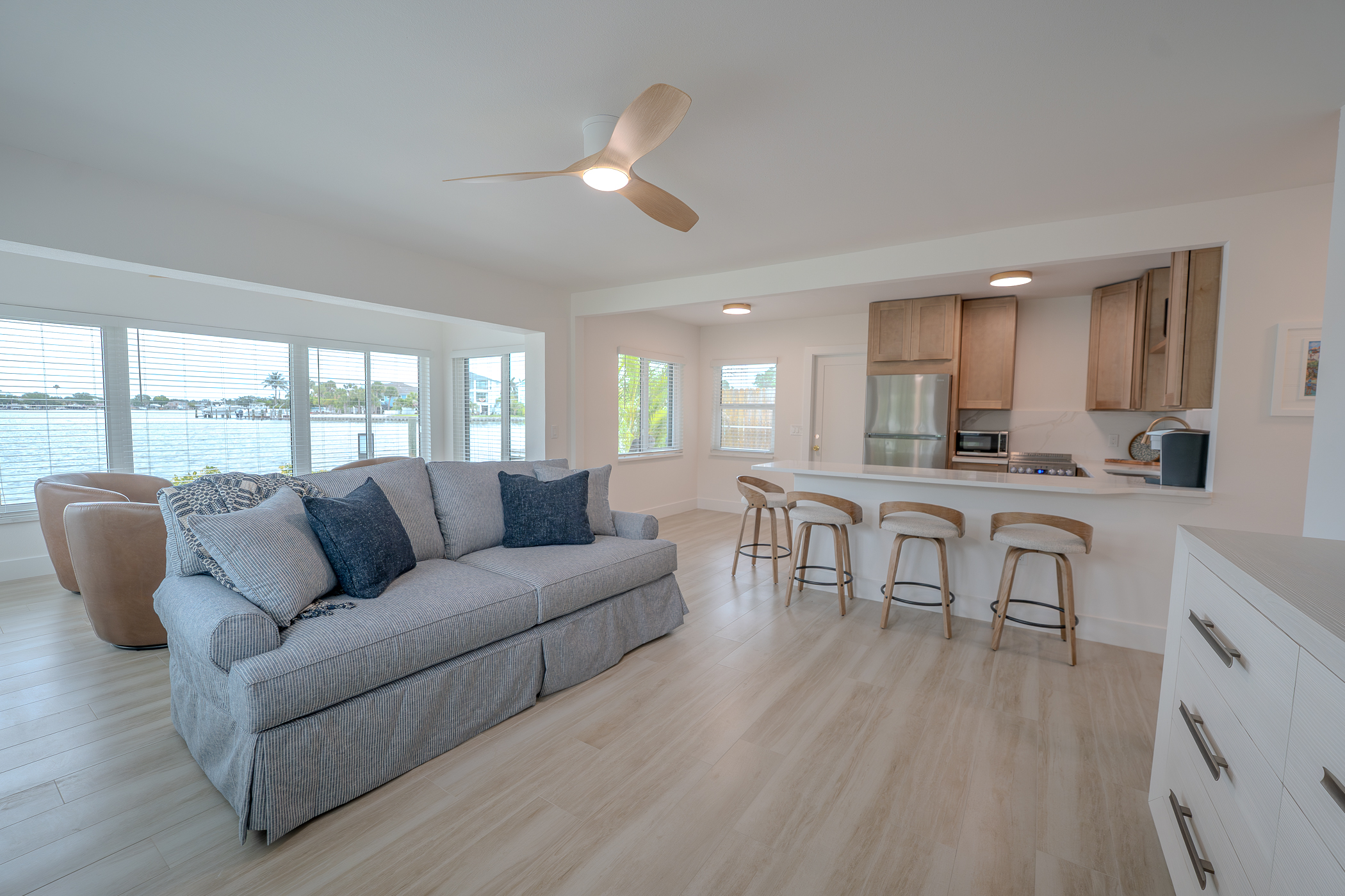 Renovated living room with custom cabinetry, flooring and cohesive finishes along the Florida beaches