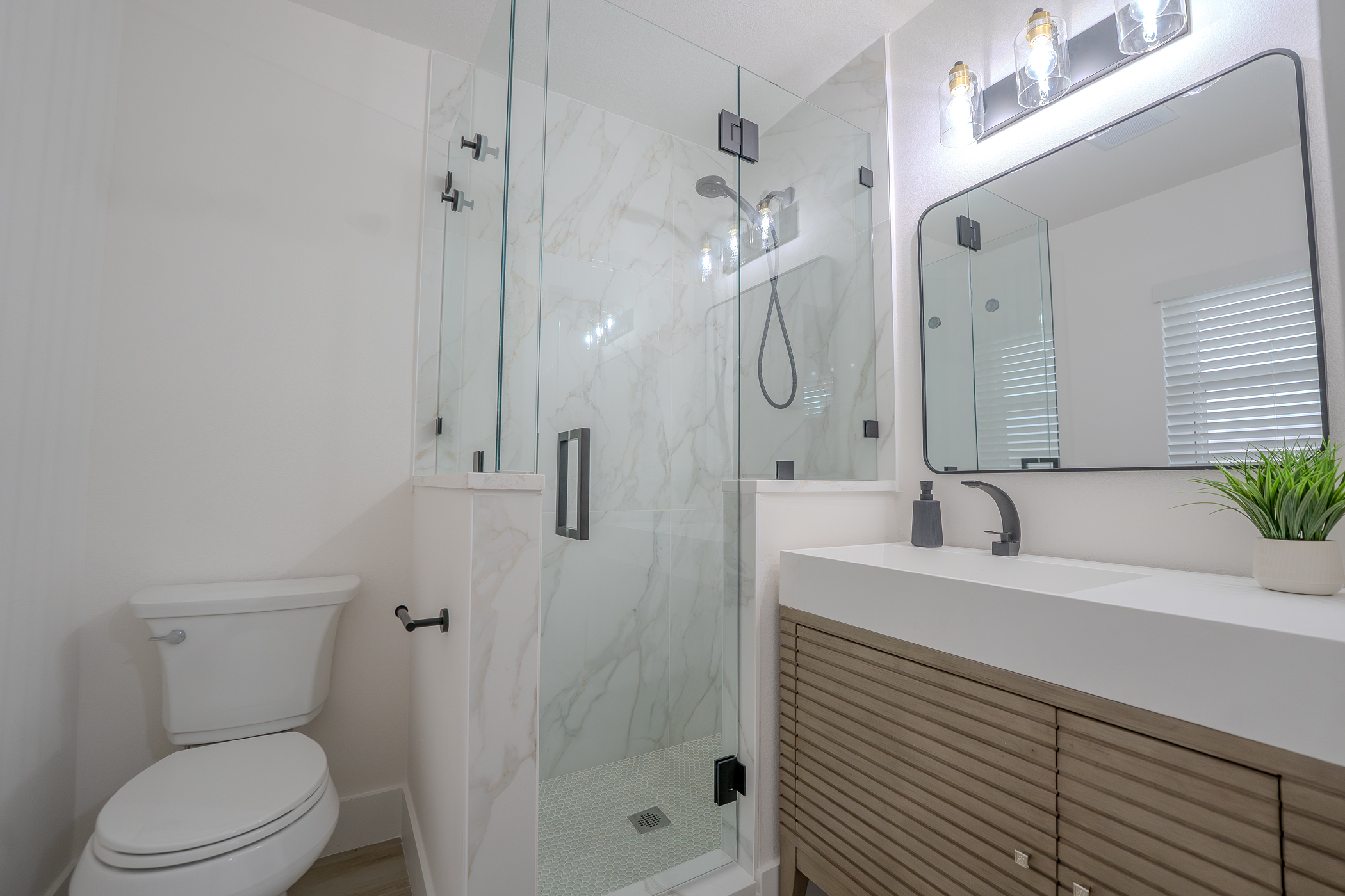 Custom bathroom renovation with freestanding tub, custom vanity and tile in Pinellas County FL
