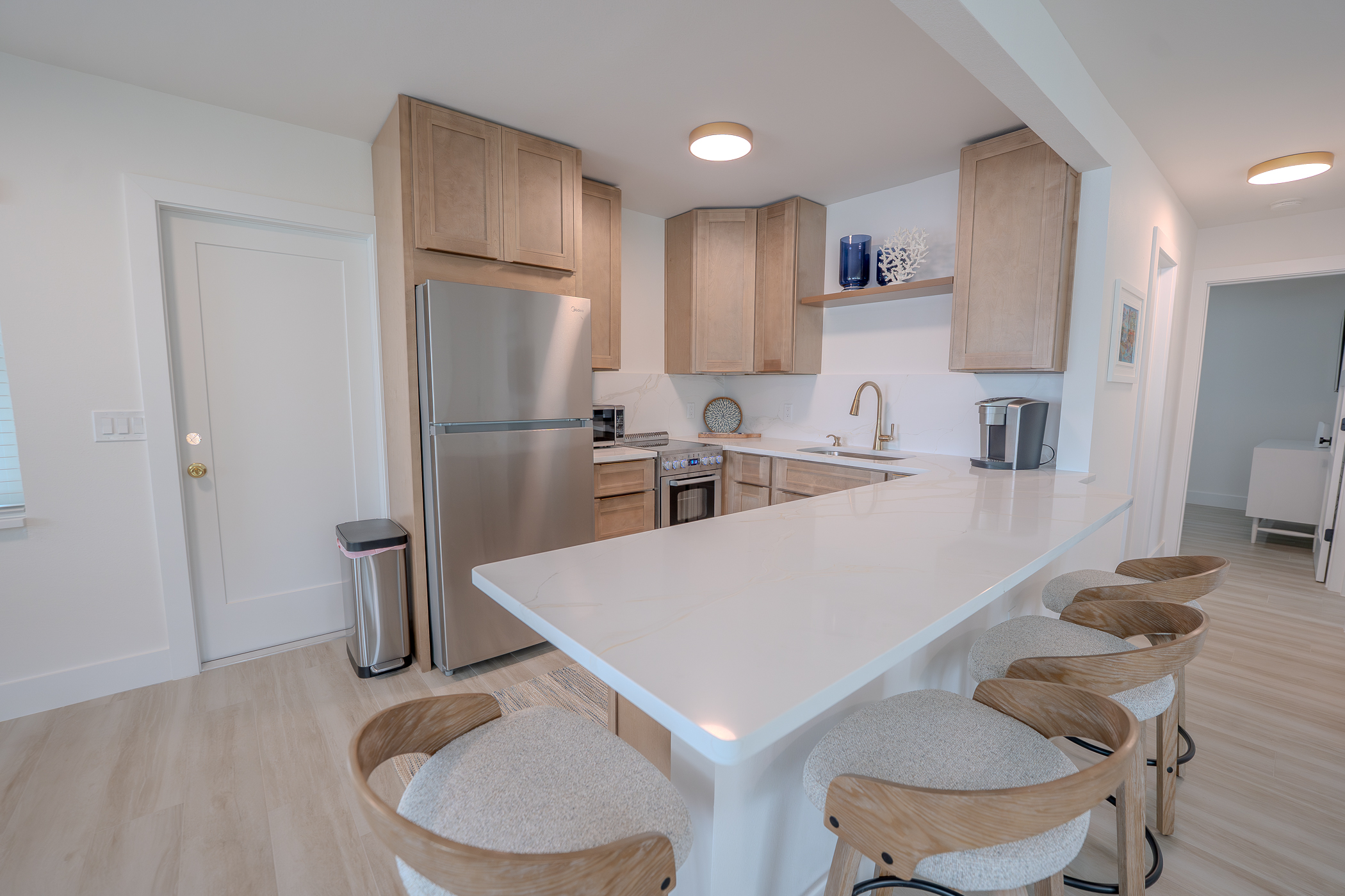Finished custom kitchen renovation with cabinetry and stone countertops in Pinellas County FL