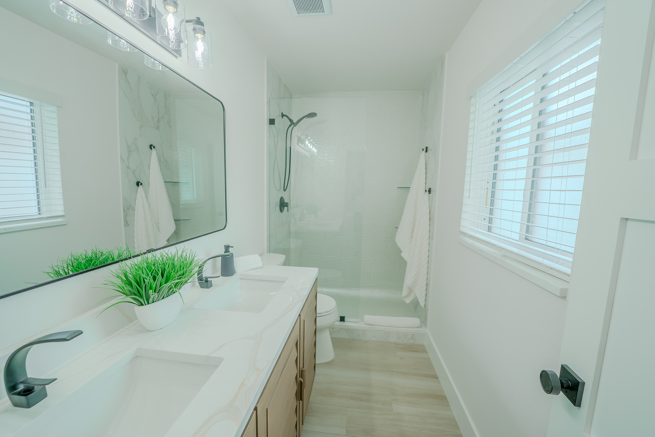 Spa-style shower renovation with tile and niche storage in Largo FL