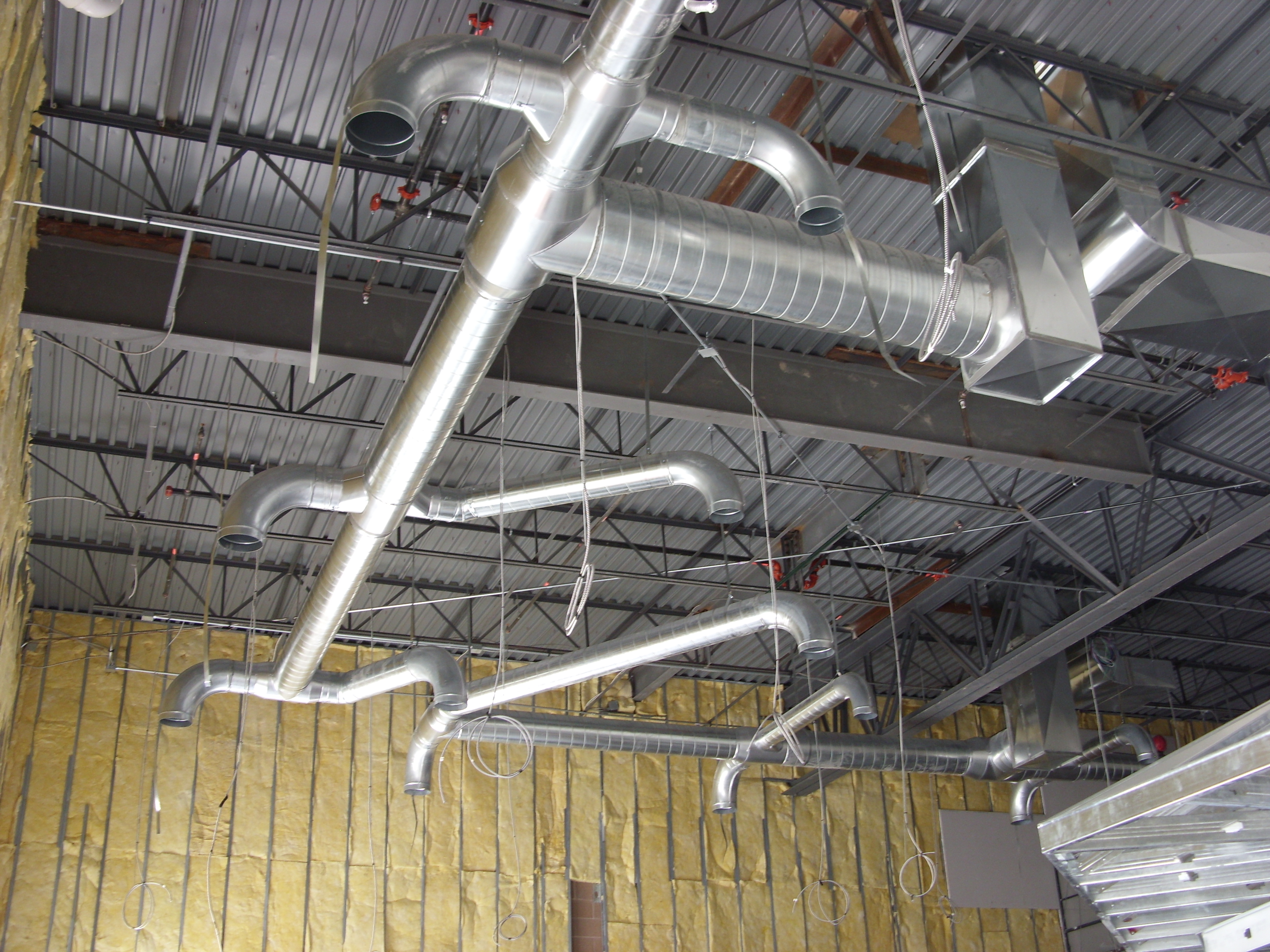 Exposed Spiral Duct Work — before
