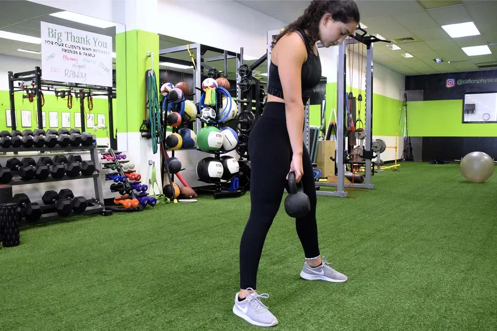 Female Athlete with Kettlebell