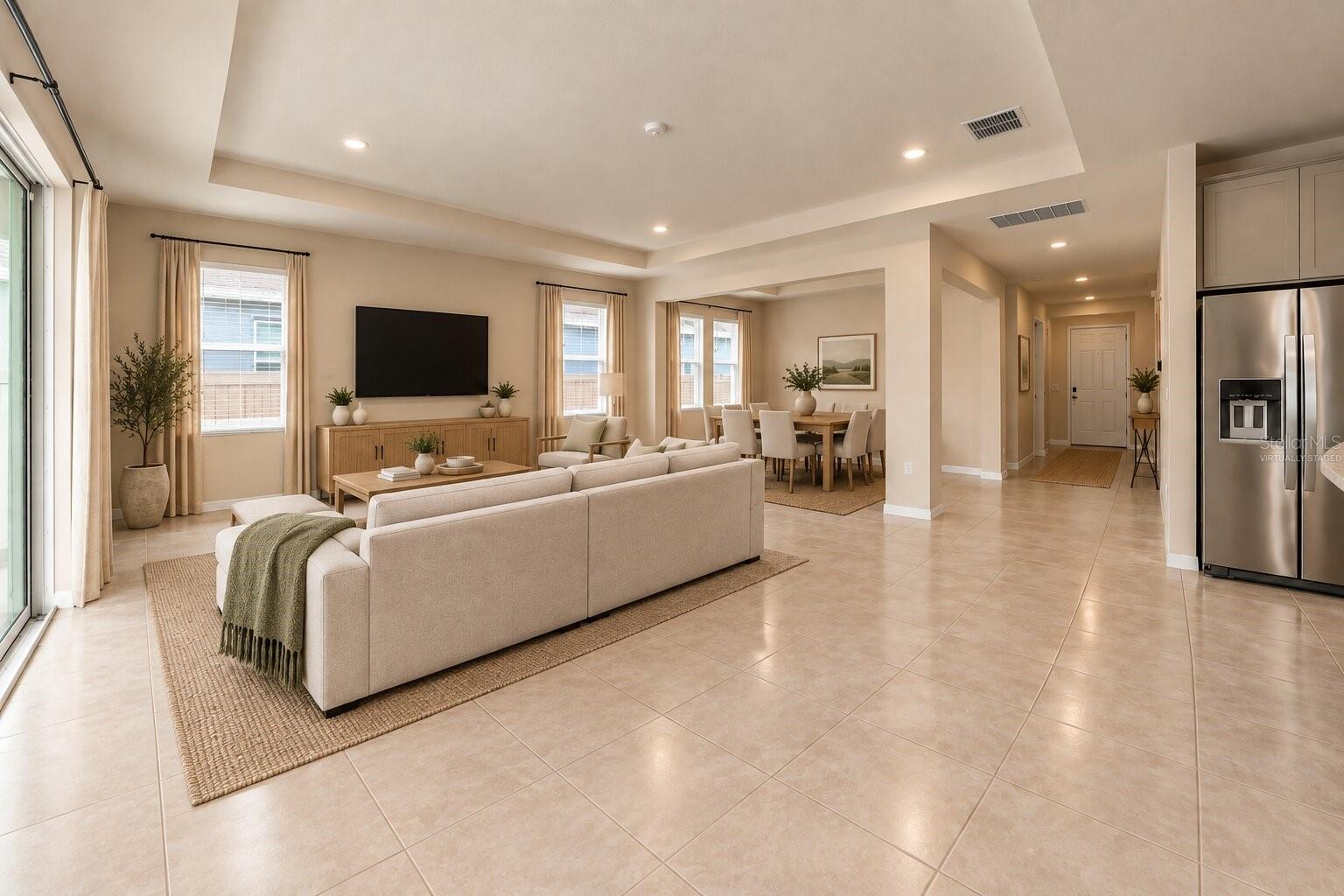 Living and dining area at 12401 Shining Willow Street. Virtually staged.
