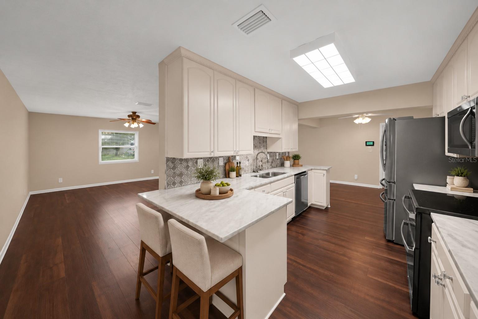 Kitchen at 116 Windy Circle. The listing includes virtually staged photography. Kitchen at 116 Windy Circle. The listing includes virtually staged photography.
