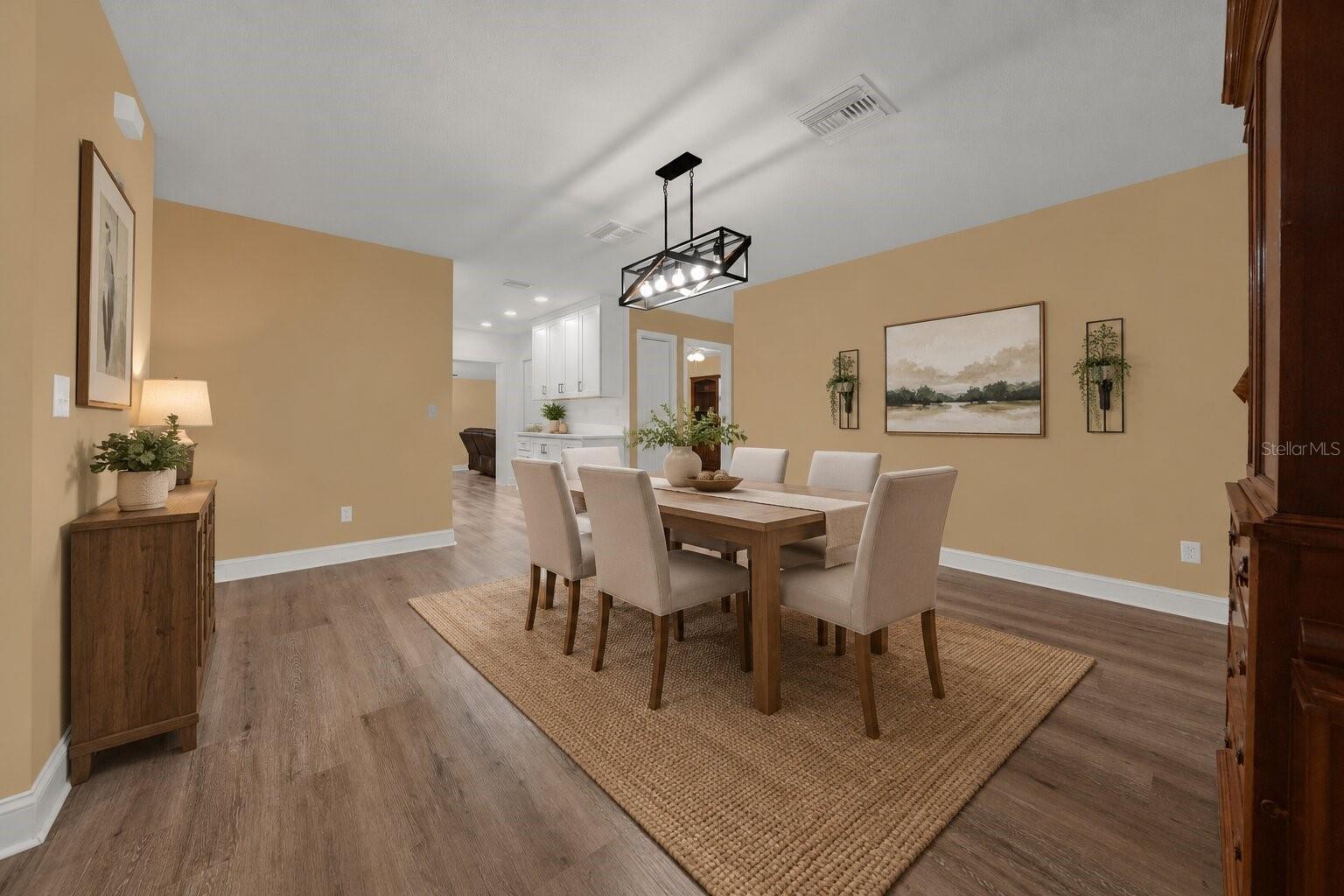Kitchen and dining area at 22002 Darley Place. The listing includes virtually staged photography.