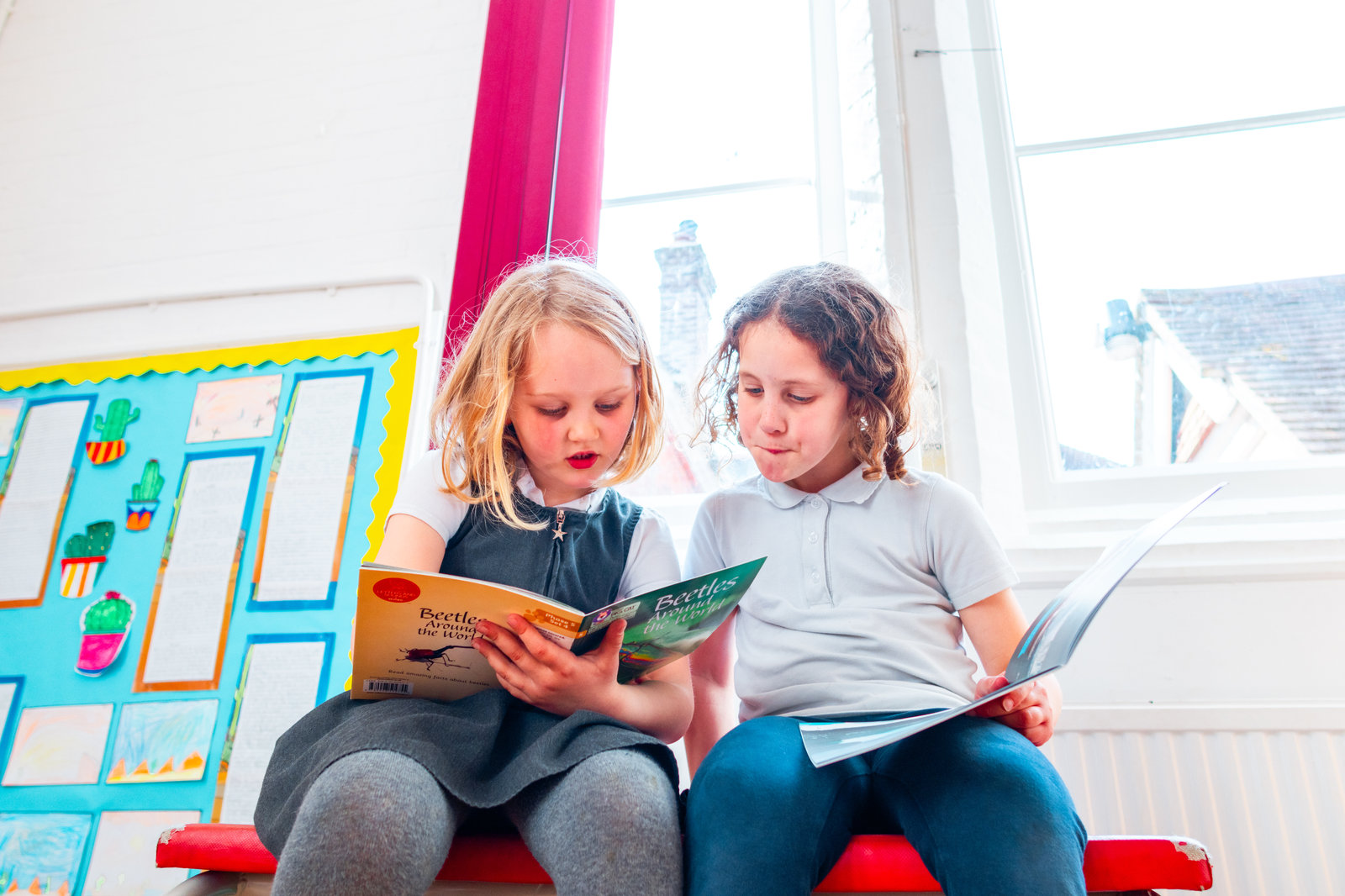 Children reading together at JC Sports wraparound care