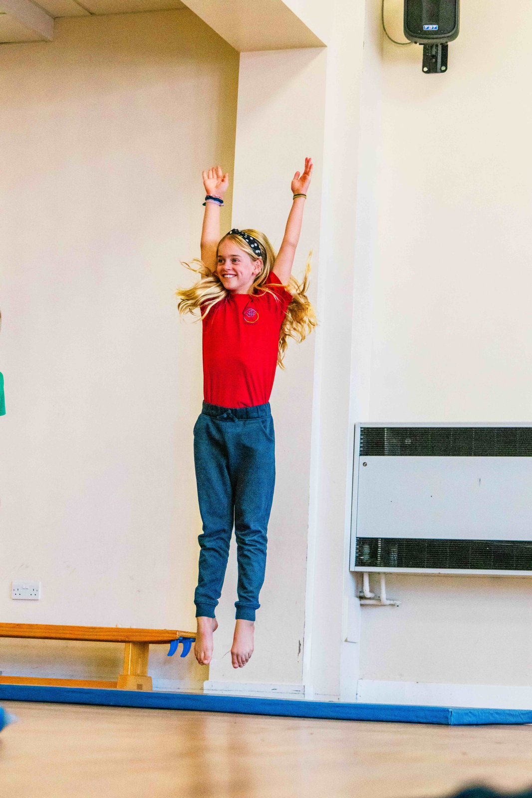 Girl jumping in a school PE lesson