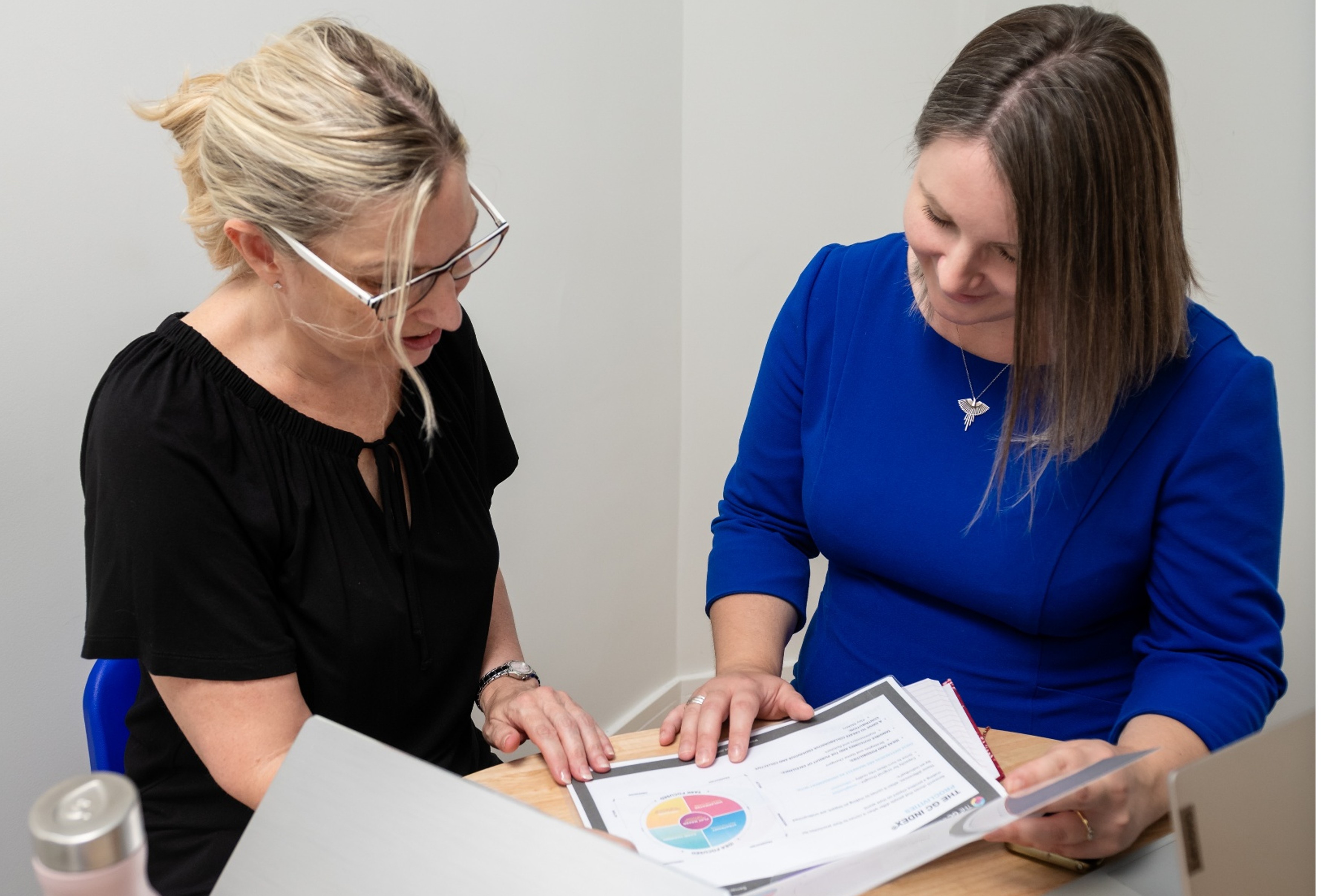 Managers discussing HR outsourcing options