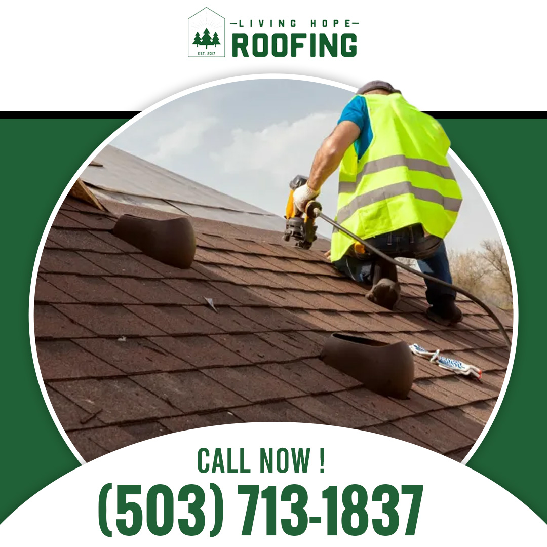 Professional roofer wearing a high-visibility safety vest kneeling on a residential roof using a pneumatic nail gun to fasten shingles.