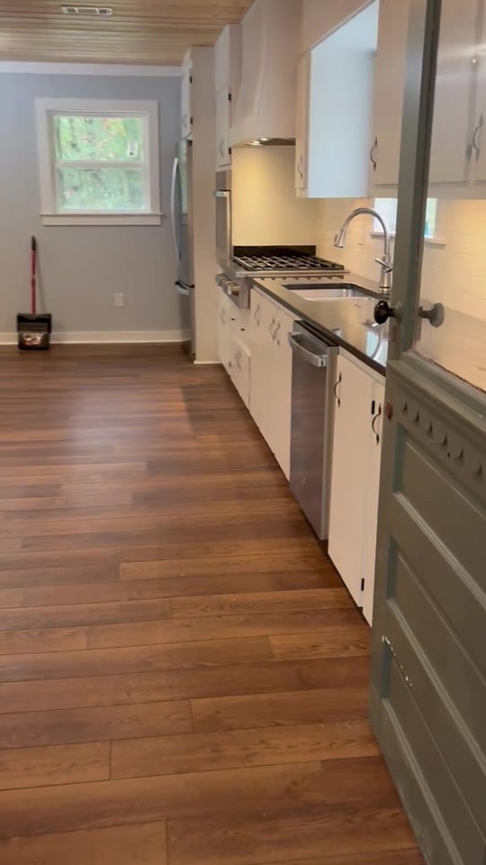 Kitchen with new plank flooring by Boren Construction