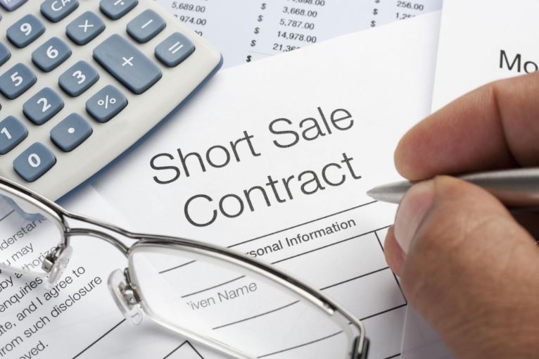 Handshake in an office representing a negotiated short sale or agreement