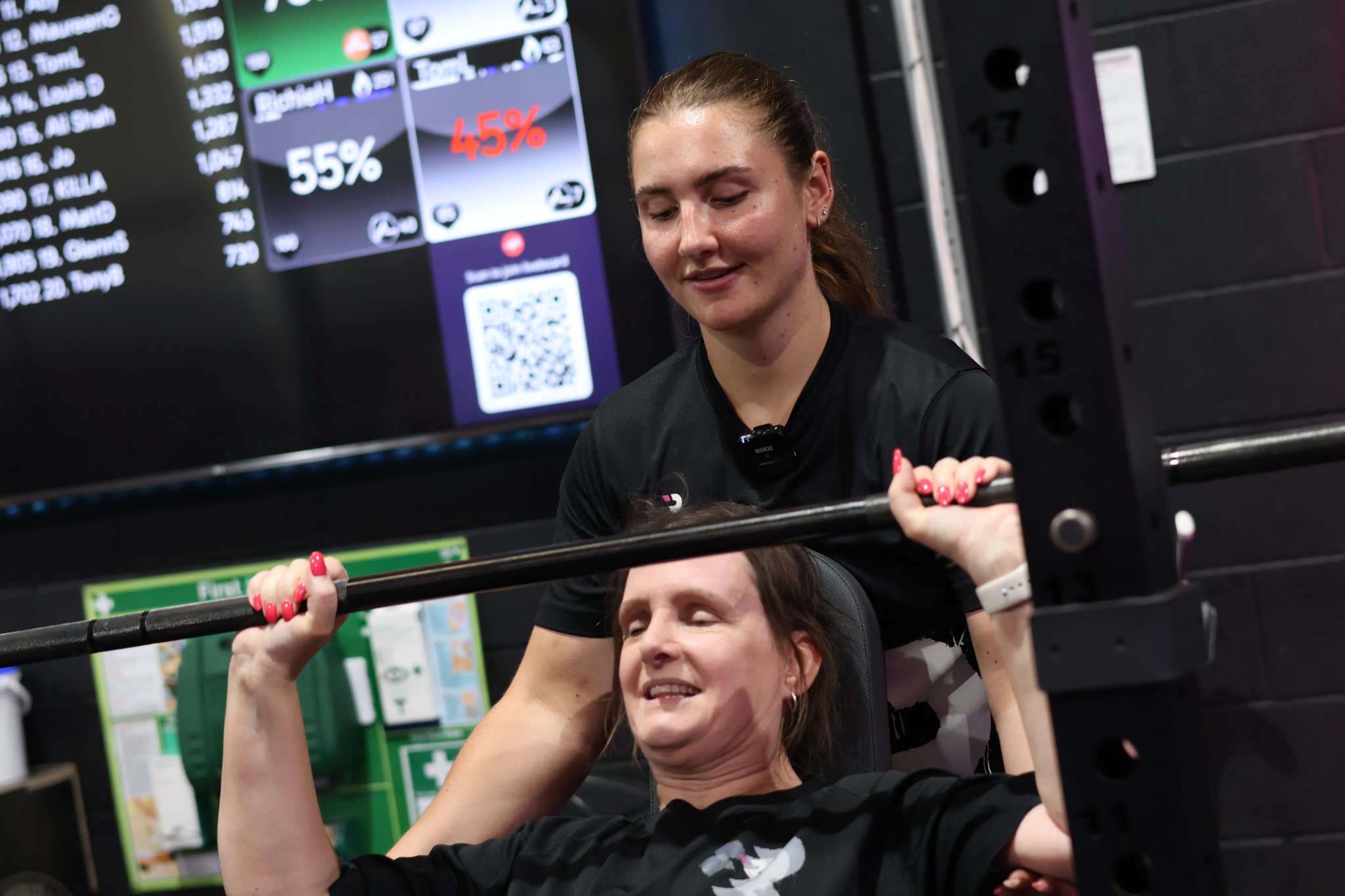 Coach supporting bench press