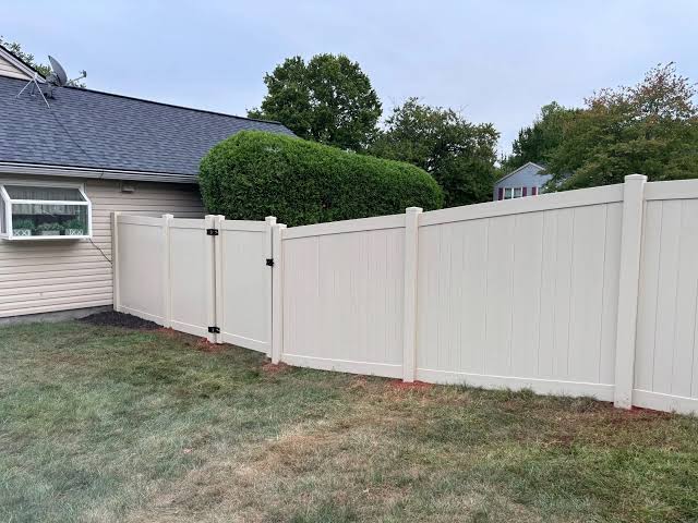 White vinyl privacy fence installation