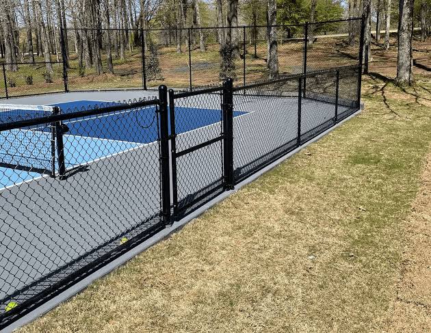Commercial galvanized and black vinyl chain link fence installation