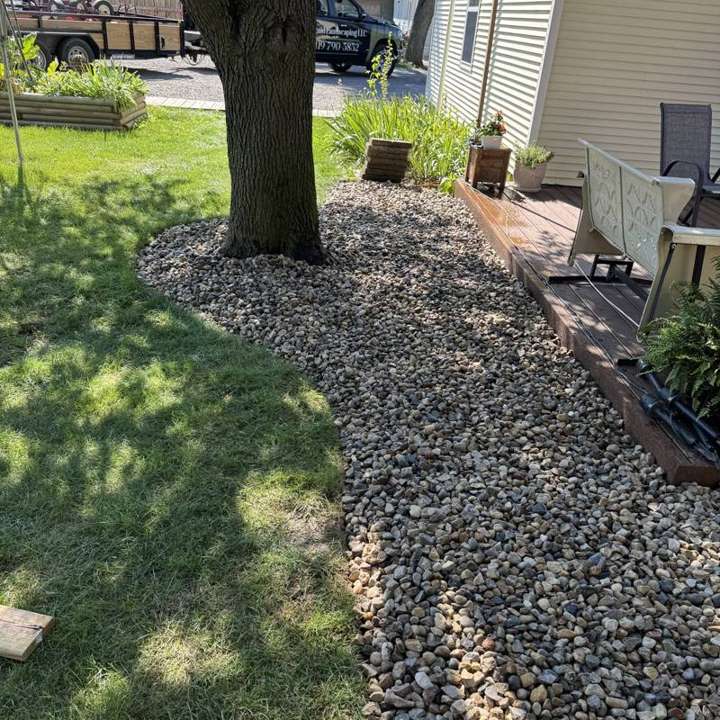River rock bed along a backyard deck