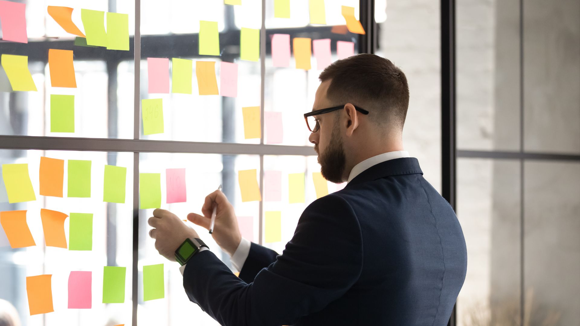 an office man with sticky notes
