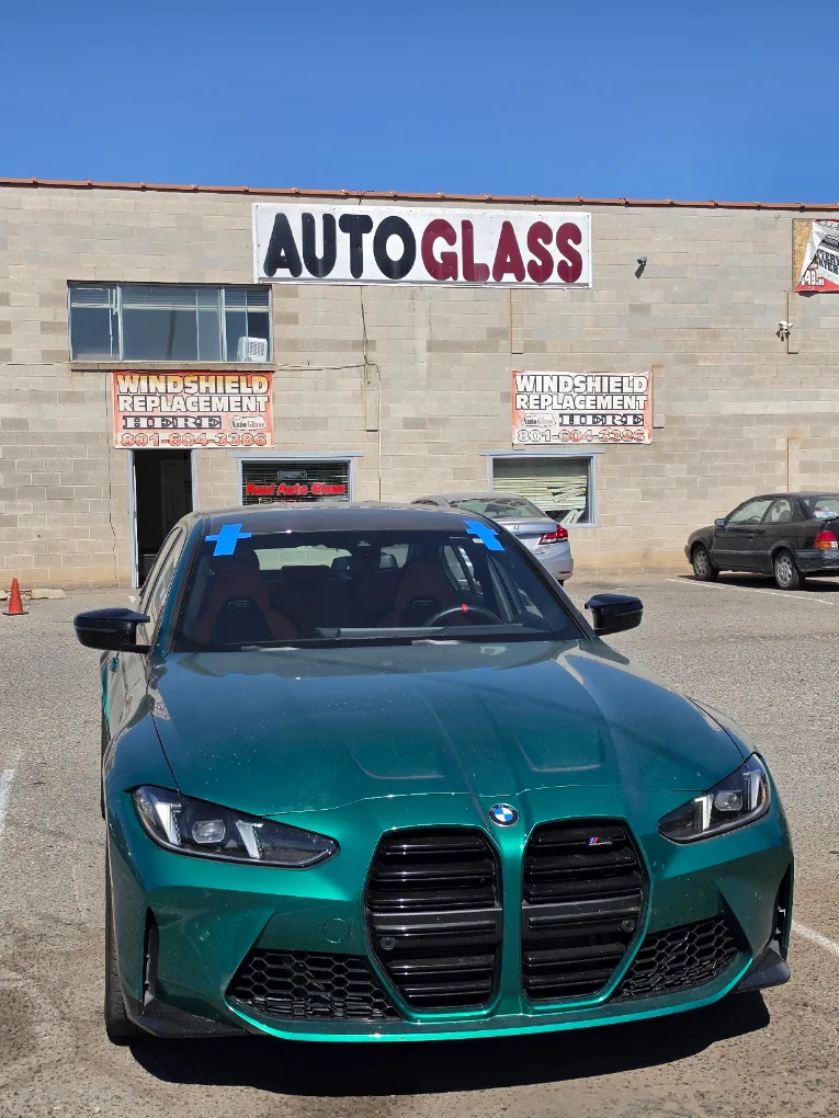 Cracked automotive glass being evaluated for repair or replacement