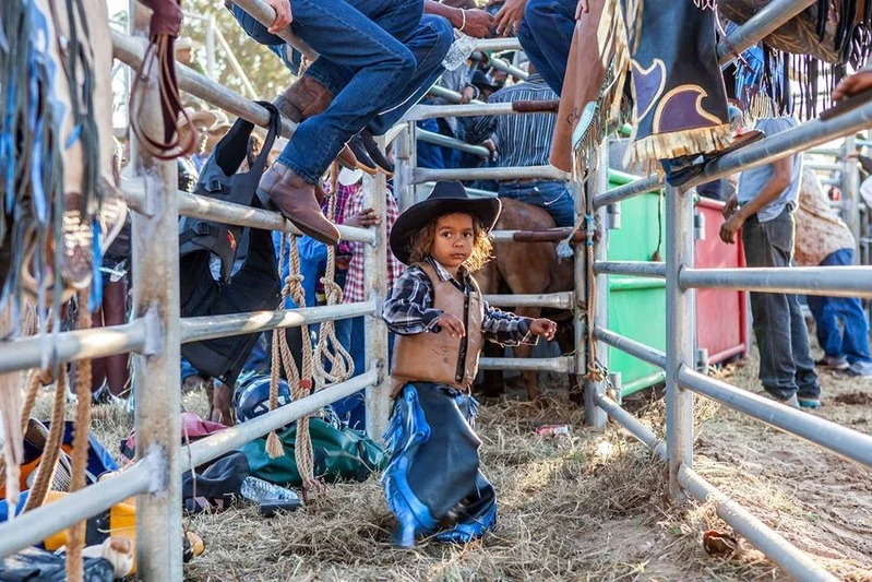 Child in chaps
