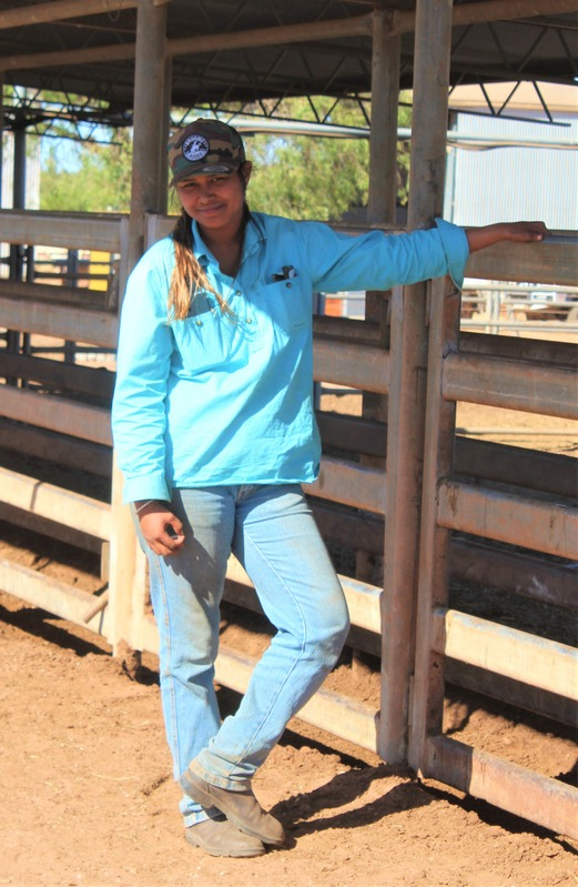 Woman leaning on fence