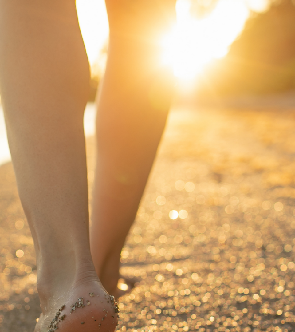 Happy healthy women walking on beach in California, functional wellness for women