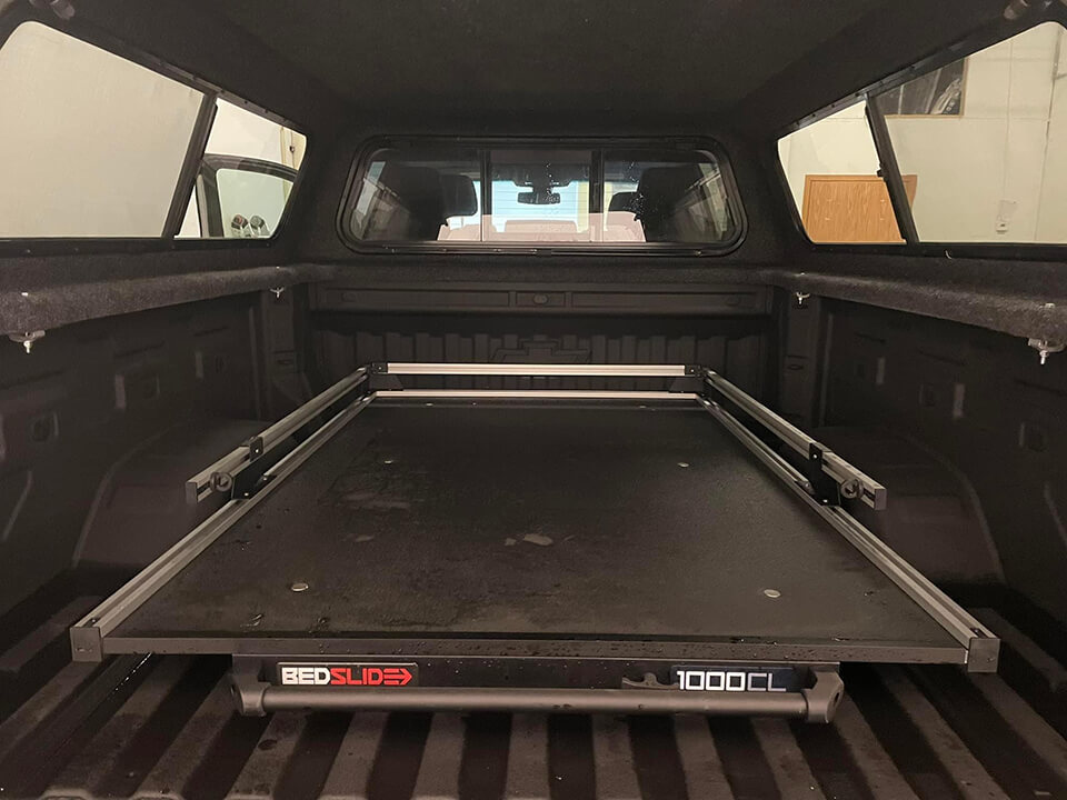 BEDSLIDE sliding platform for easy access to truck bed, designed for durability and convenience.