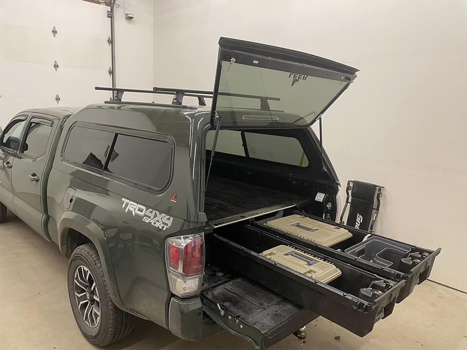 DECKED and BEDSLIDE premium bed drawers for organized truck storage in harsh conditions.