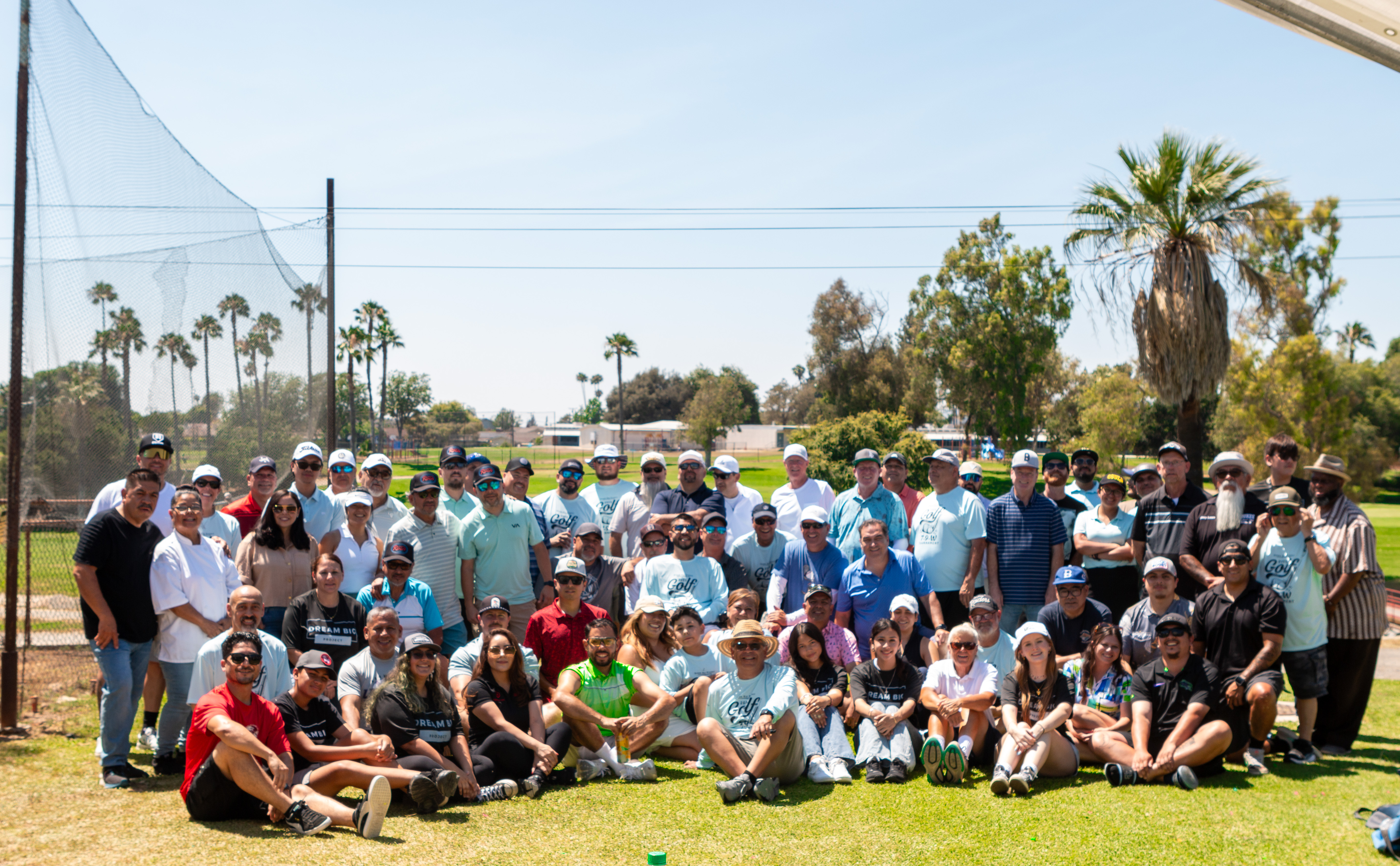 Golfers and volunteers gathered on the course at the 7-9-W Golf Tournament